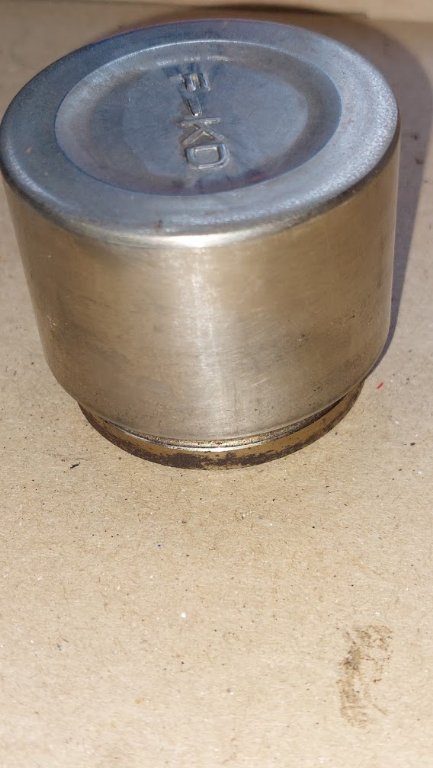 Driver side brake piston, after cleaning 2.jpg