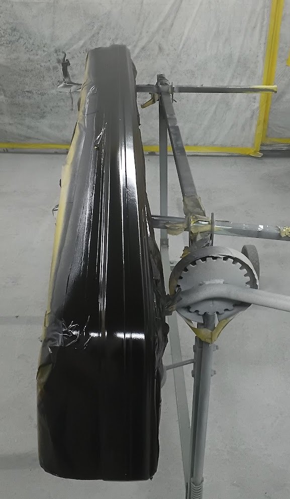 Rear bumper being painted